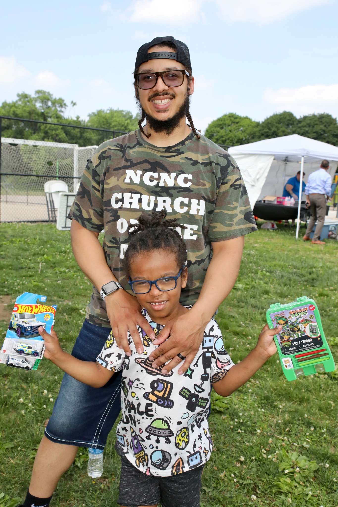 Smiling kid at arts table at Family Field Day 2025
